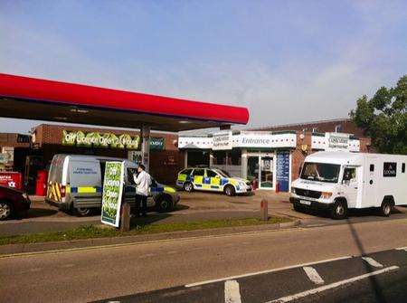 Police at the scene of an armed robbery at the Murco petrol station in Ashford