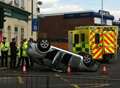 Driver escapes serious injury as car overturns in town centre