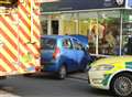 Woman hurt as car ploughs into chemist's