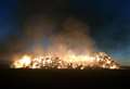 Fire breaks out in field near homes