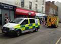 Woman taken to hospital after shop fall