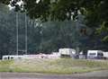 Claims police 'escorted' travellers to illegal encampment