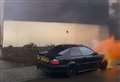 BMW bursts into flames in bus lane