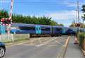 Horrific close shave as train goes through level crossing with barriers up