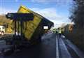 Delays as lorry sheds its load