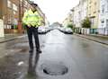 Hole opens up in middle of street