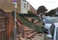 Cars hit in wall collapse drama