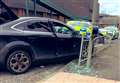 Car crashes into crossing in police chase