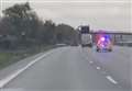 Watch: Driver swerves in front of police on M25