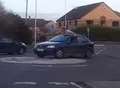 Man spotted 'surfing' on moving car
