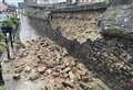 Ancient church wall collapses onto high street