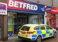 Cash taken in betting shop robbery