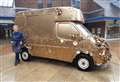 Golden ice cream van on display in shopping centre