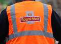 Postman knocked unconscious in attack 