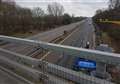'Distressed woman' on motorway bridge halts traffic