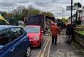 Man dies after lorry overturns