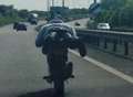 Idiot biker 'planks' on dual-carriageway