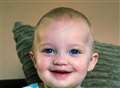 Smiling toddler beats rare cancer