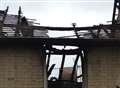 Update: Dozens of firefighters tackle roof blaze