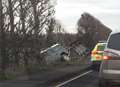 Land Rover and trailer crashes into ditch off major road