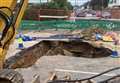 Road to stay closed for days while huge sinkhole fixed