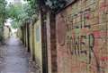 Racist graffiti daubed in alley