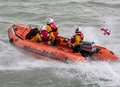Three men rescued from sinking dinghy