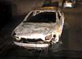 Car found 'burnt out' on busy residential street