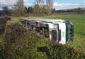 Lorry topples over and lands in field