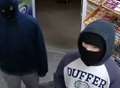 Hunt for hooded thugs who demanded cash from till 