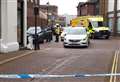Police tape off town centre as air ambulance called