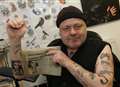 Musician's newspaper cutting tattoo