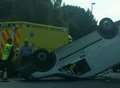 Van overturns as crash with lorry shuts main road