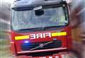 Vehicle fire blocks busy road
