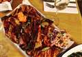 BBQ joint cooks up a storm at new location