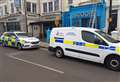 Police and forensics teams line seafront