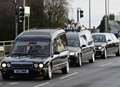 Procession of TWELVE limos for funeral 