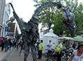 Video: Dinosaurs roam the streets at festival