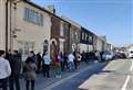Hundreds queue in town's streets to vote 
