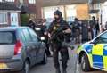 Armed police surround home