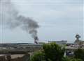 Smoke billows into sky at harbour