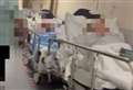 NHS 'on its knees' as footage shows patients lining corridors