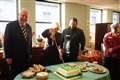 Queen cuts cake with sword as she celebrates charity’s 25th birthday