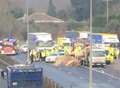 Man cut free after lorries crash with car