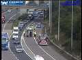 Delays as car flips onto side on M2