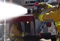 Crews tackle garage fire