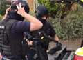 Armed police raid house in money laundering probe