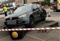 Bin flattened in two-car crash