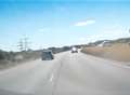 Video: Motorist drives wrong way up busy road