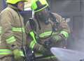 Firefighters tackle car fire